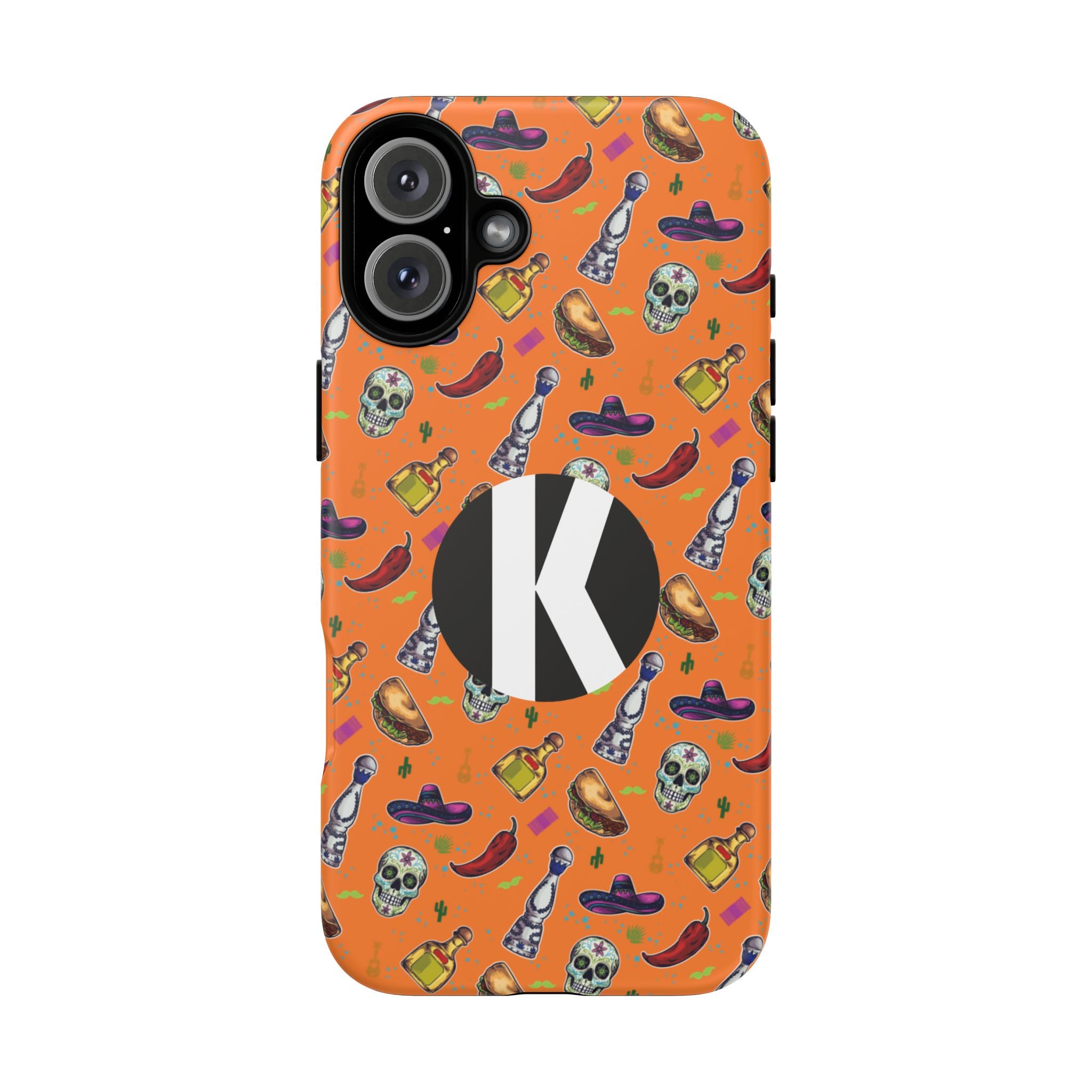 An orange phone case with a repeating pattern of skulls, chili peppers, and bottles, featuring a large black circle with a white letter 'K' in the center.