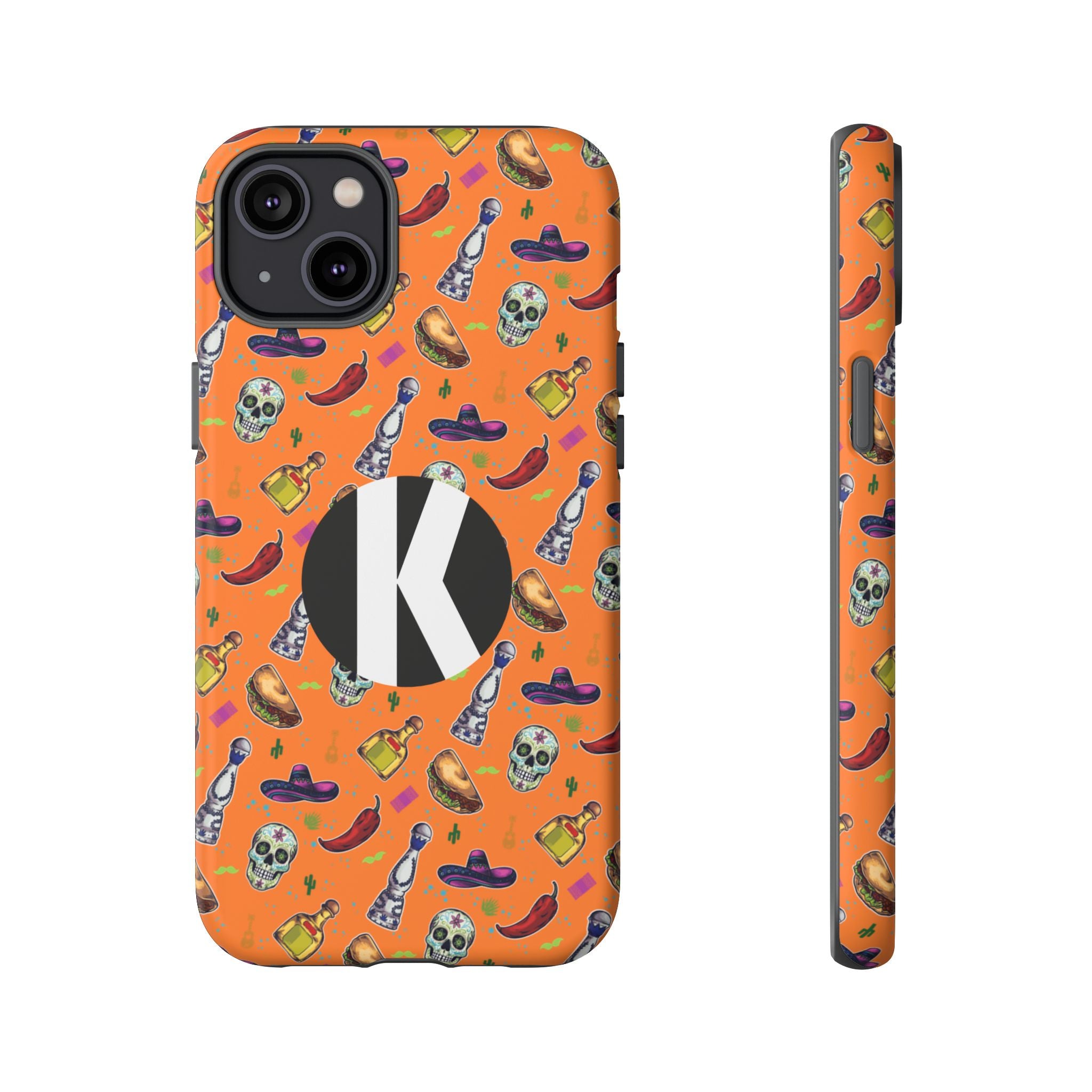 An orange phone case with a Mexican-themed pattern of skulls, sombreros, hot dogs, and tequila bottles, featuring a large black circle with a white letter 'K' on the back. A side profile of the case is shown next to it on a plain white background.