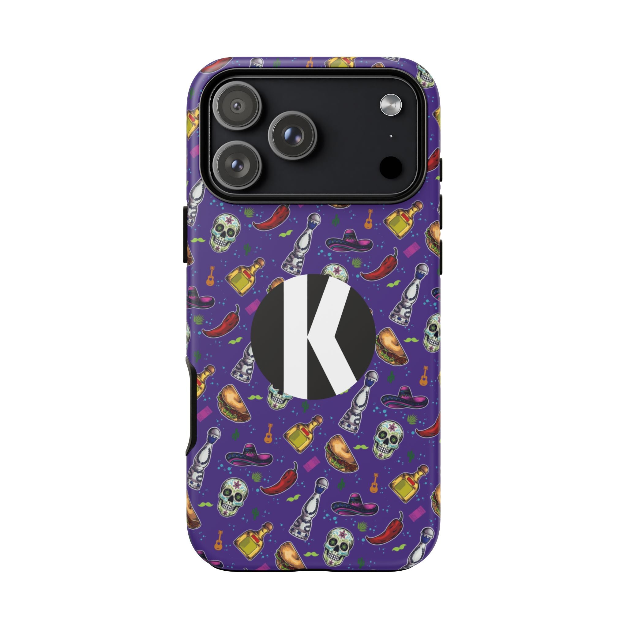 A purple phone case with a repeating Halloween-themed pattern of skulls, chili peppers, bottles, and hats, featuring a large black circle with a white letter K on the back.