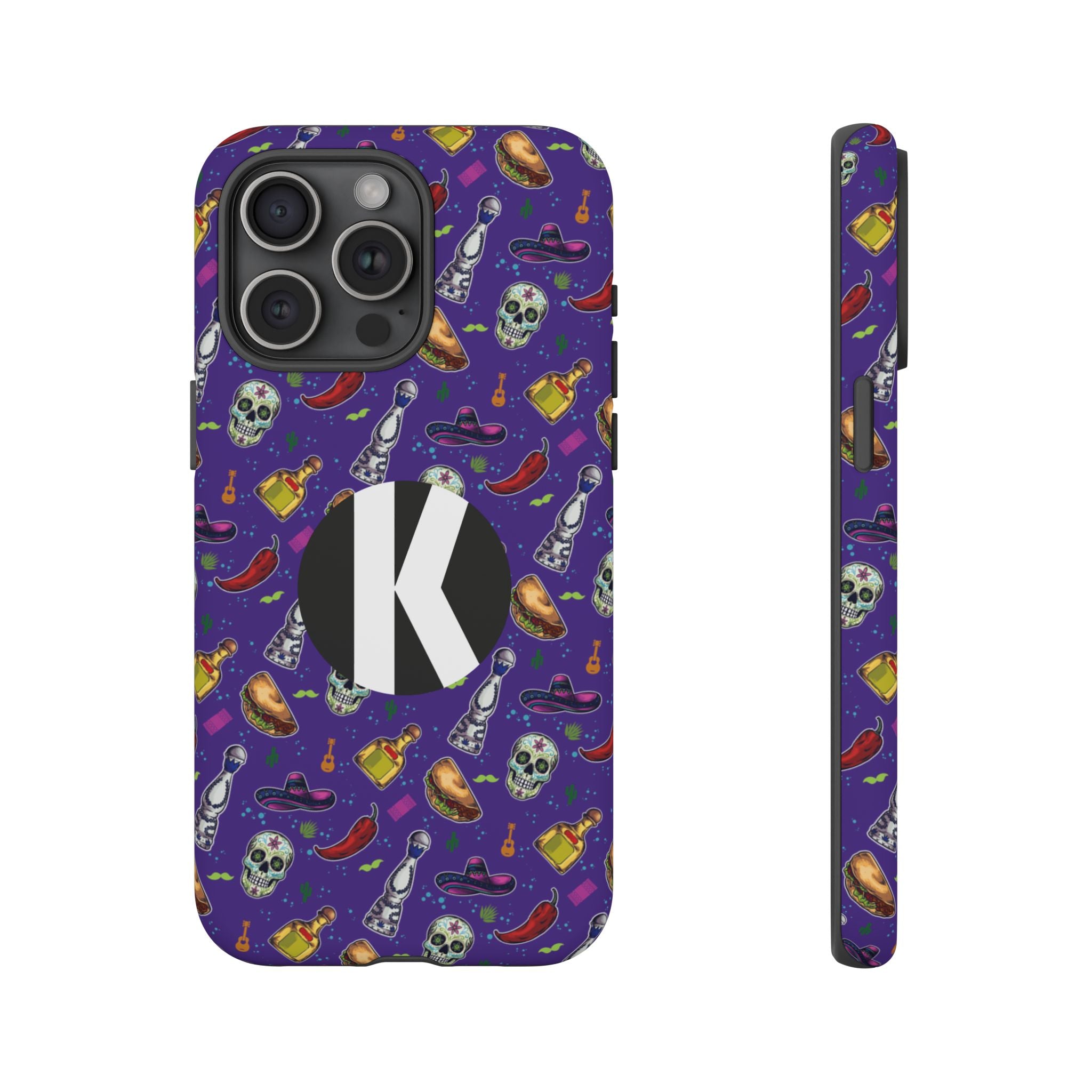 A purple phone case with a repeating Halloween-themed pattern of skulls, hot peppers, and bottles, featuring a large black circle with a white letter 'K' on the back. Shown from the rear and side views on a plain white background.