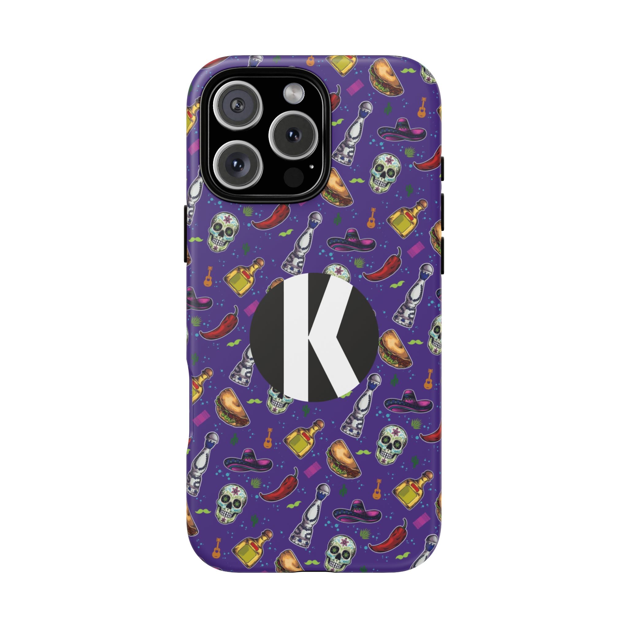 A purple phone case with a Halloween-themed pattern of skulls, witch hats, bottles, and chili peppers, featuring a large black circle with a white letter 'K' on the back.