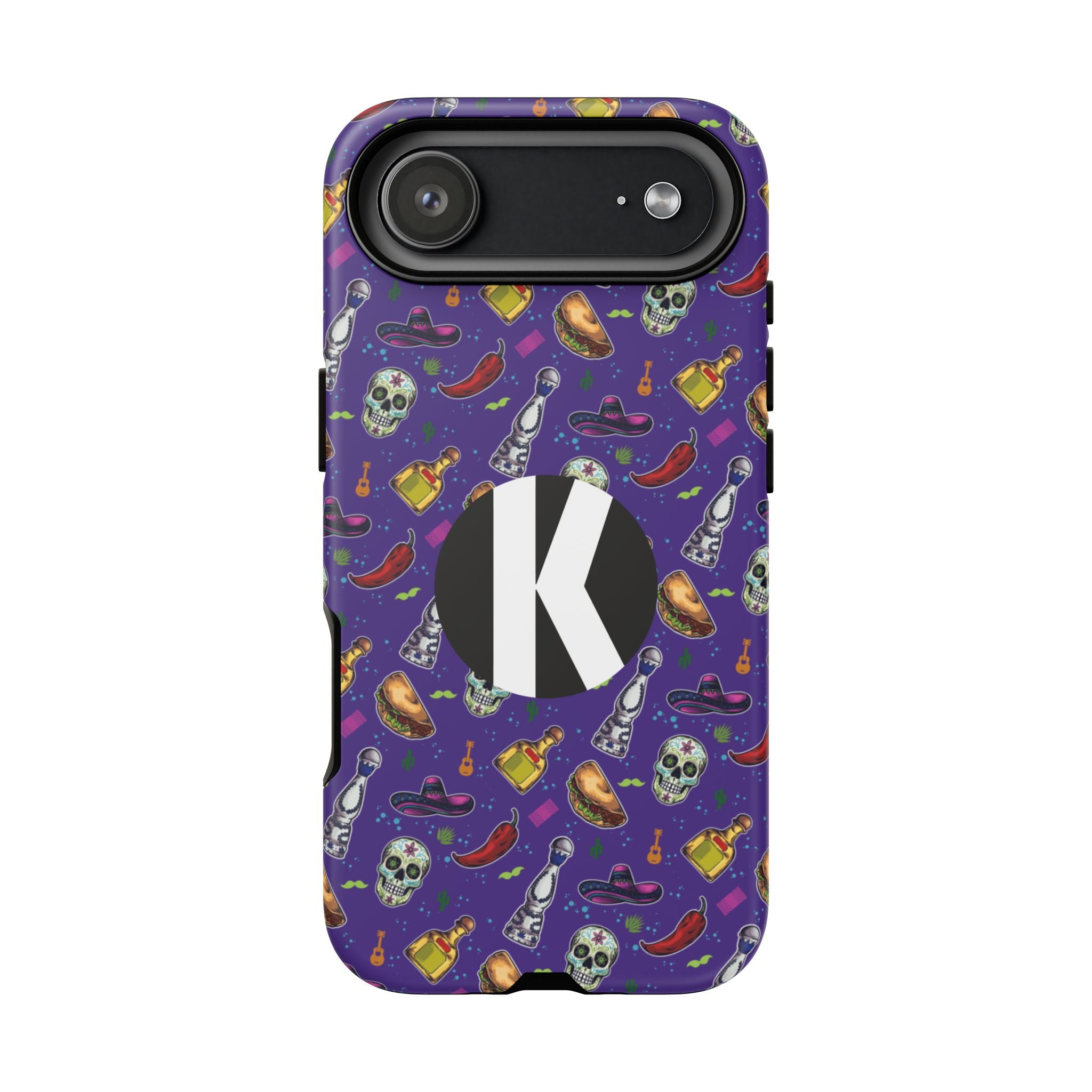 A purple phone case with a Halloween-themed pattern of skulls, chili peppers, bottles, and hats, featuring a large black circle with a white letter 'K' on the back.