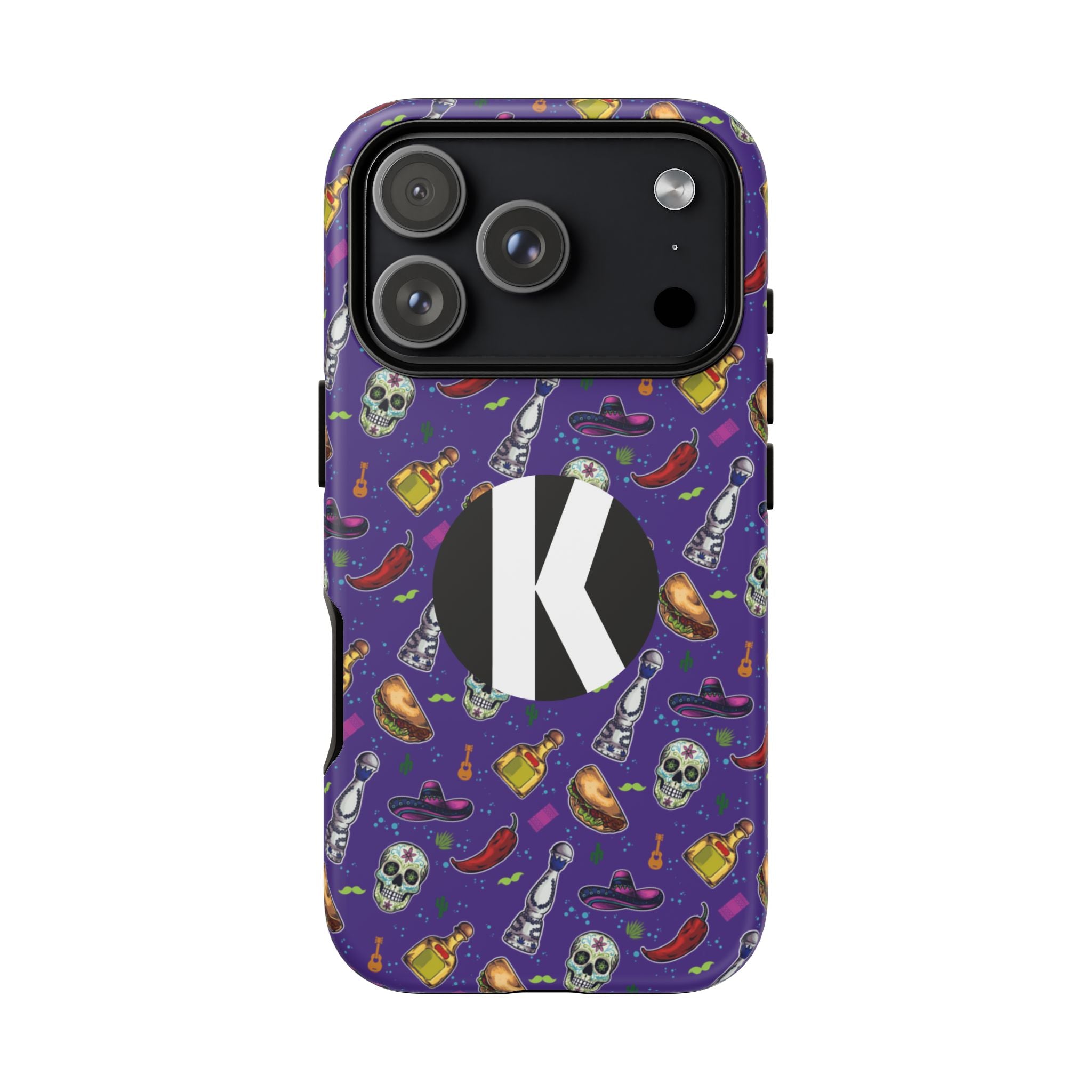 A purple phone case with a Halloween-themed pattern of skulls, chili peppers, potion bottles, and witch hats, featuring a large white letter 'K' on a black circle on the back.