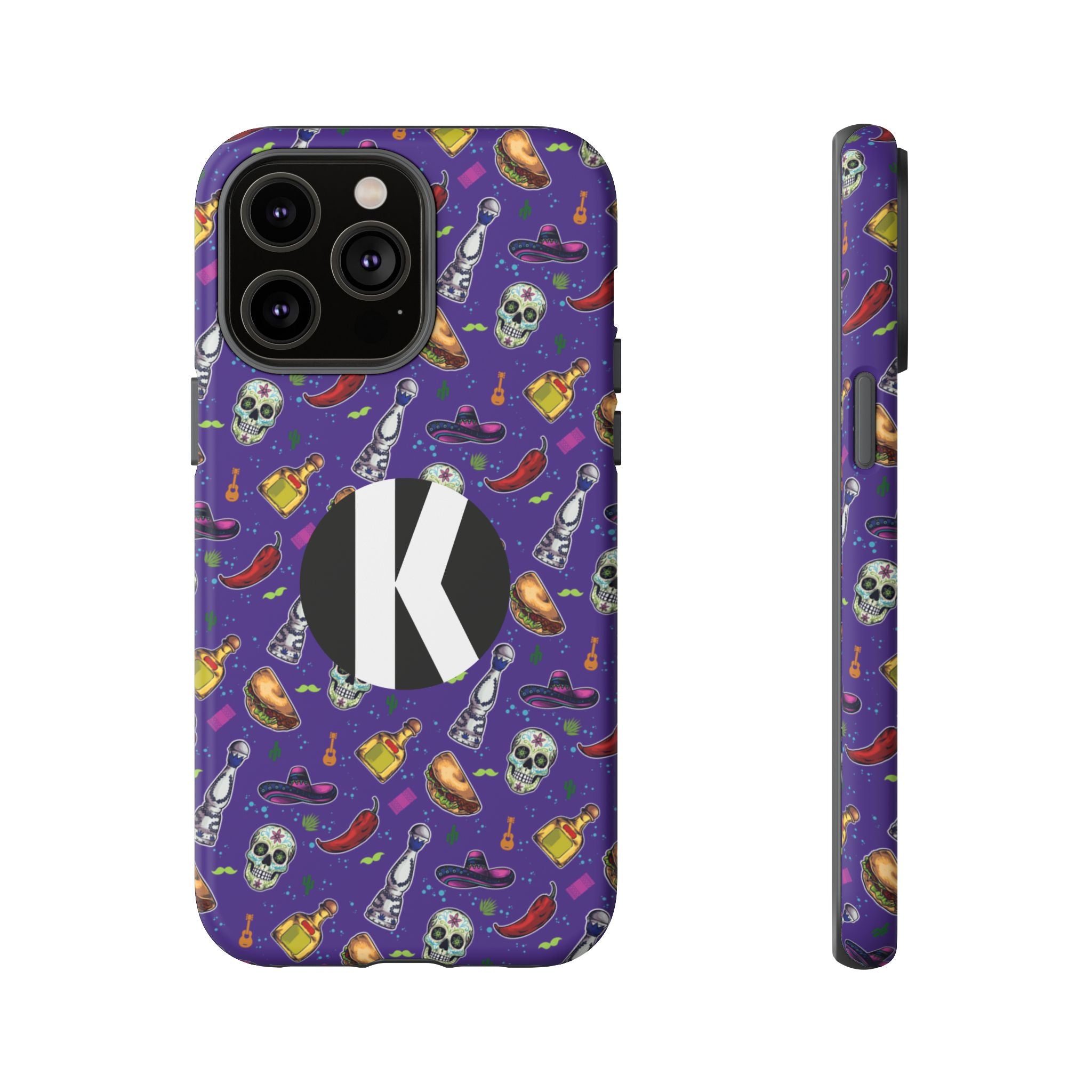 A purple phone case with a repeating pattern of skulls, bottles, and sombreros, featuring a large black circle with a white letter K on the back. A side profile of the case is shown next to it on a plain white background.